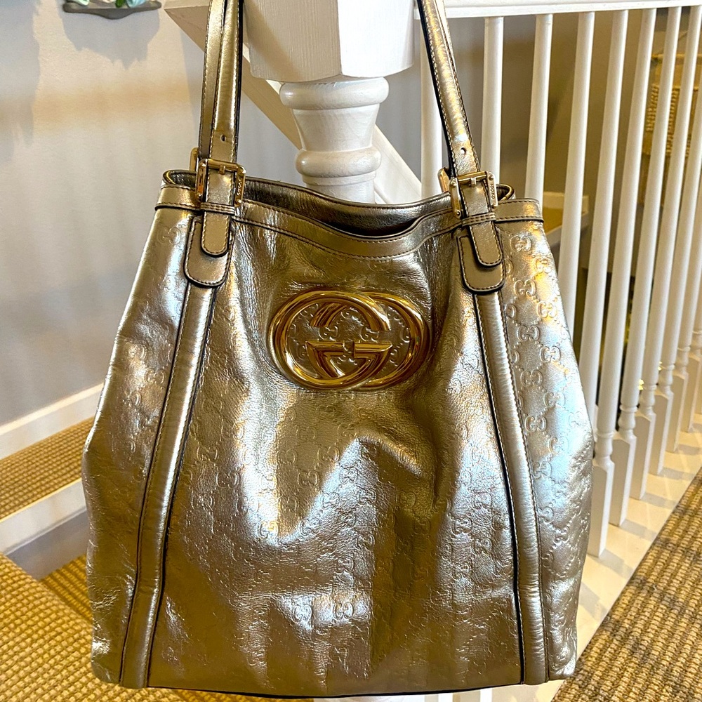 All leather Gucci metallic gold monogram tote.